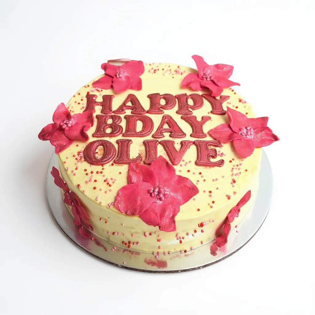 Happy birthday Olive cake with pink fondant flowers