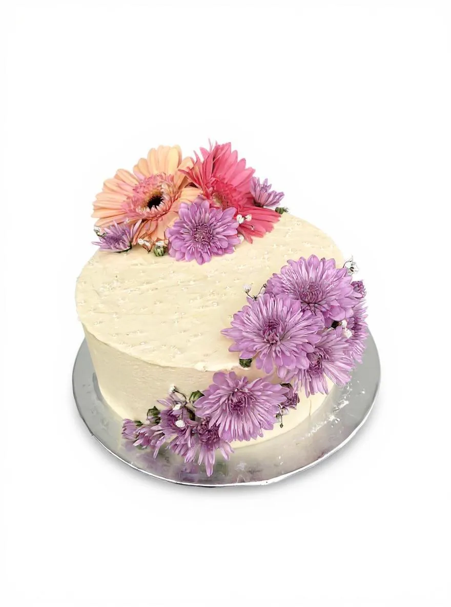 Elegant floral cake with fresh purple and peach gerberas